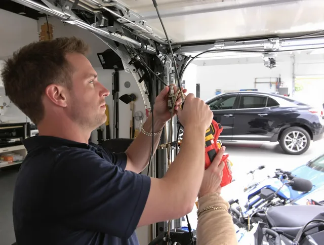 Kent Garage Door Repair safety certified technician performing cable replacement in Kent