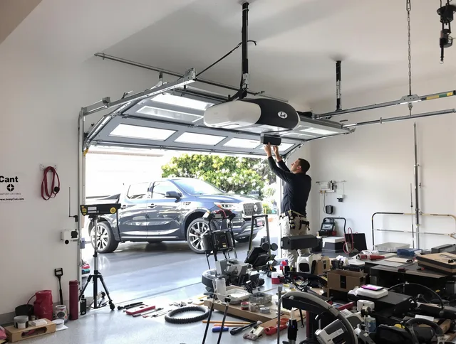 Kent Garage Door Repair specialist installing smart garage door opener system in Kent home