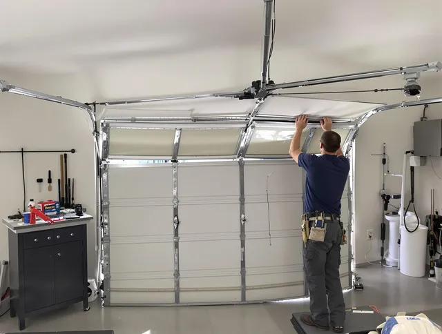 Kent Garage Door Repair specialist performing precise section replacement on Kent garage door